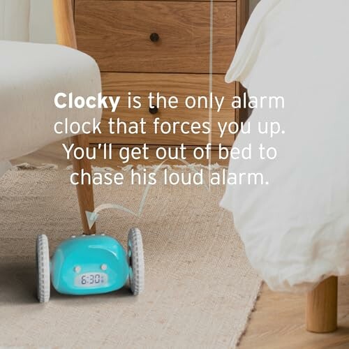 Clocky alarm clock on wheels under a bed.