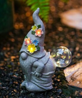 Whimsical garden gnome with flower hat and bubble