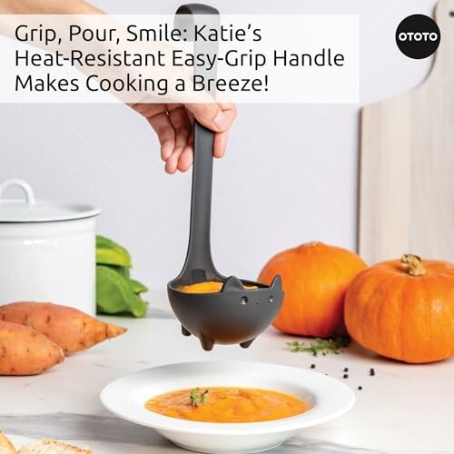 Person pouring soup with OTOTO kitchen ladle next to pumpkins.