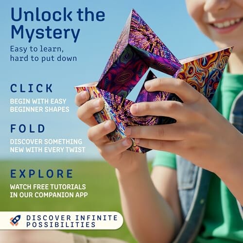 Child playing with a colorful puzzle cube.